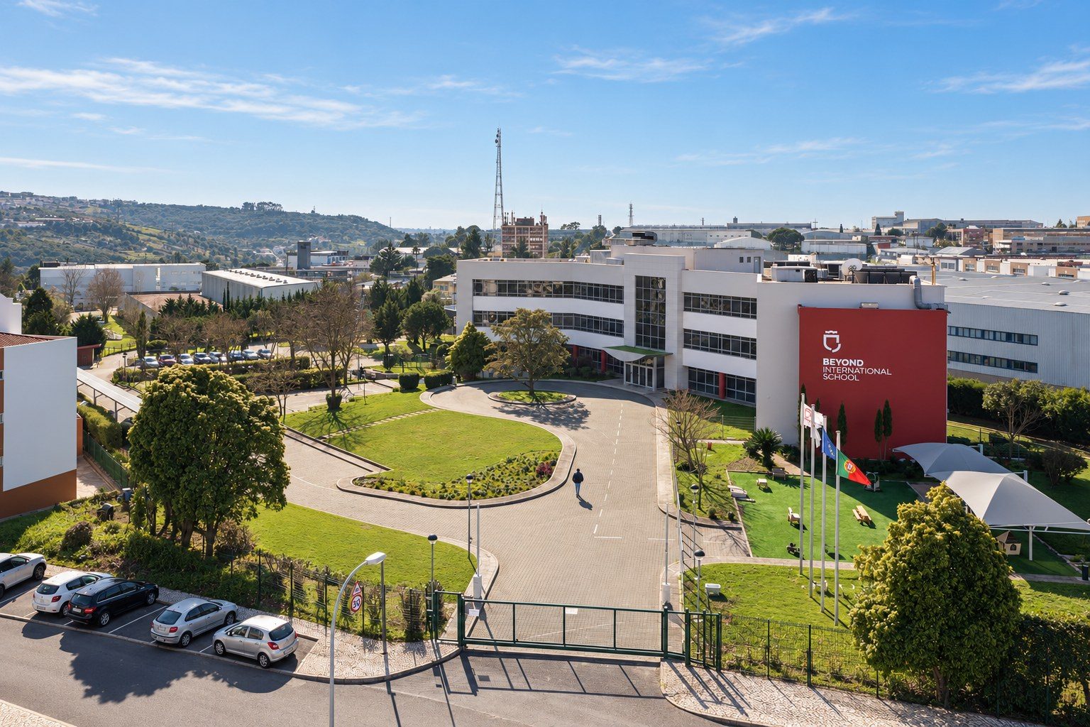 Beyond International School, the red entrance façade with the school logo